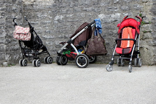 three mom strollers with clutter